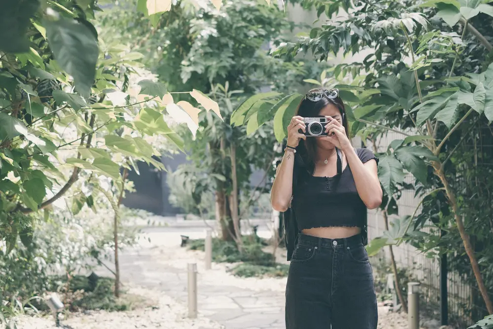 Amber taking a photo in Japan